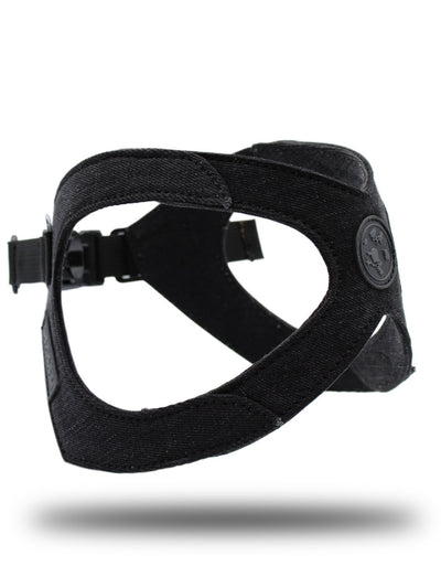 Custom made black denim dog harness hovers on photoset against a white background.