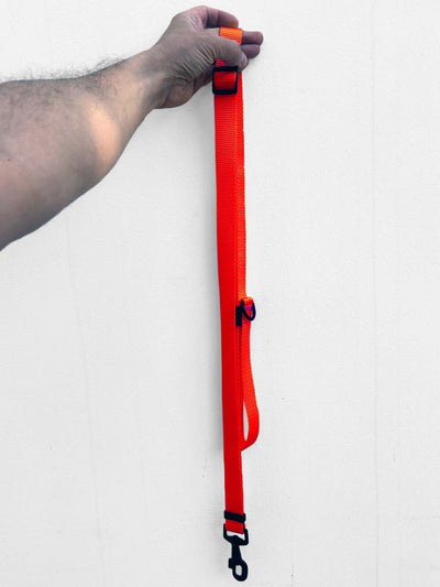 MAGNUS Canis adjustable length leash in neon orange color.