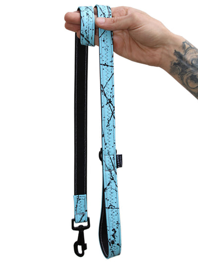 A light blue vegan leather dog leash with black hand painted pattern by MAGNUS Canis.