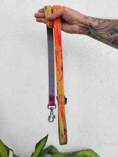 Vegan leather dog leash by MAGNUS Canis with bright orange and green pattern that is a limited edition.