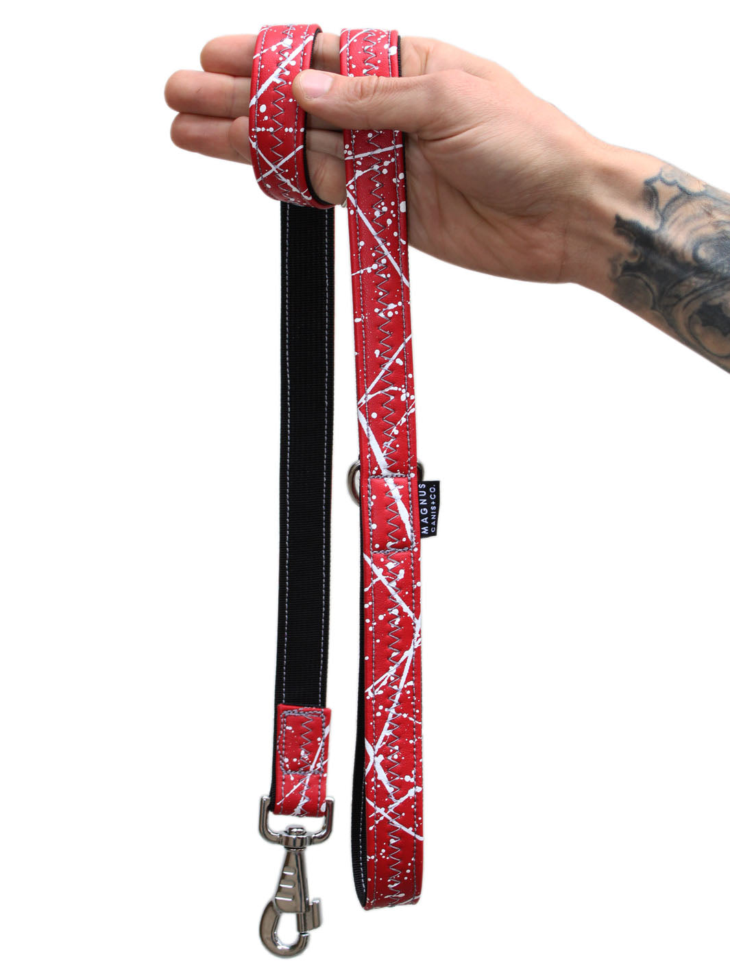 A red vegan leather dog leash with white hand painted pattern by MAGNUS Canis.