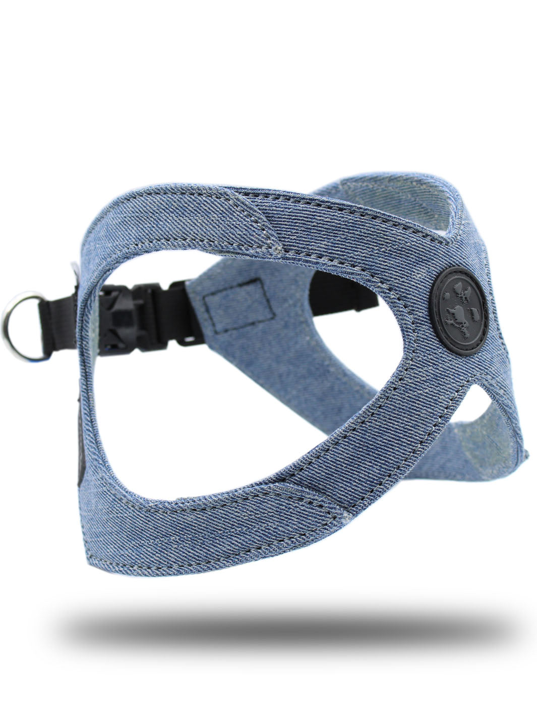 MAGNUS Canis custom made blue denim dog harness floats above the ground against a white back drop..