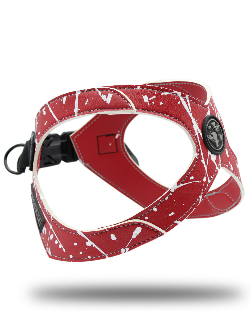 Bright red and white patterned french bulldog harness by MAGNUS Canis floats above a white surface.